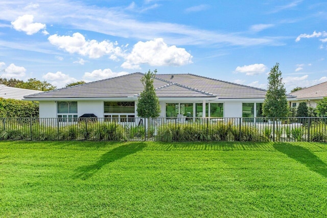 11955 N Lake Dr, Boynton Beach, FL 33436 - rear view of property with a lawn