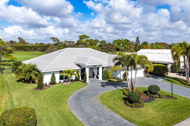 11955 N Lake Dr, Boynton Beach, FL 33436 - view of front of home with a garage and a front lawn