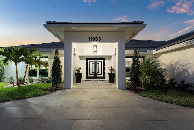 11955 N Lake Dr, Boynton Beach, FL 33436 - view of exterior entry at dusk