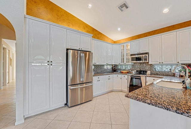 kitchen with stainless steel appliances, sink, and white cabinets