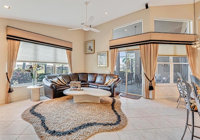 living room with ceiling fan and light tile patterned flooring