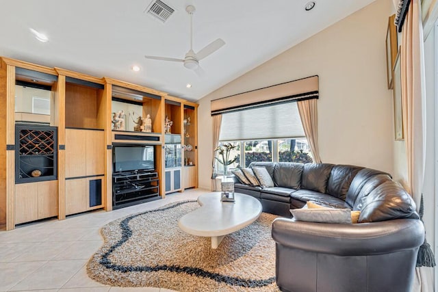 tiled living room featuring lofted ceiling and ceiling fan