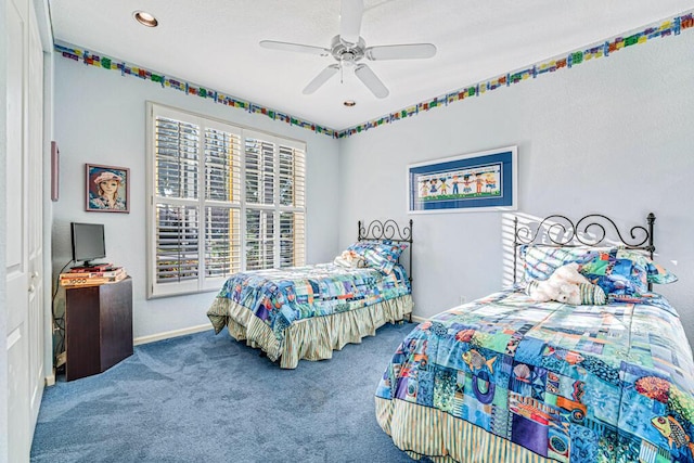 bedroom with ceiling fan and carpet floors