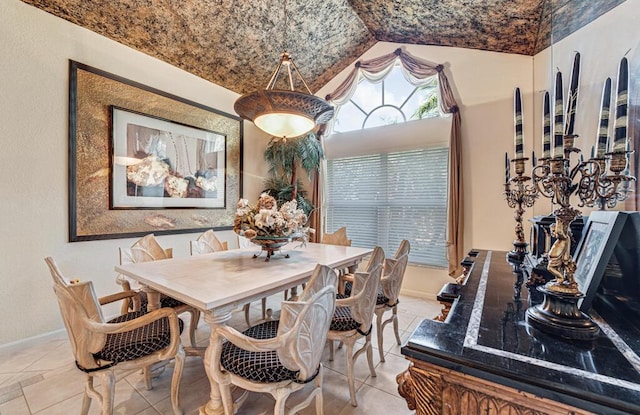 dining room featuring lofted ceiling and brick ceiling