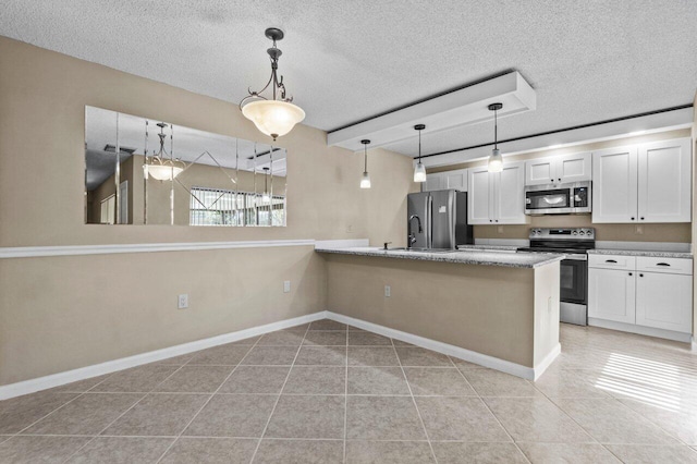 kitchen with white cabinetry, appliances with stainless steel finishes, and kitchen peninsula