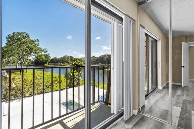 balcony featuring a water view