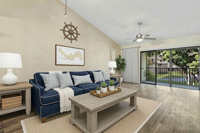 living room featuring hardwood / wood-style floors, high vaulted ceiling, and ceiling fan