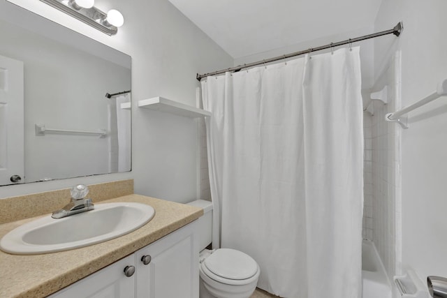 bathroom with shower / bath combo, vanity, and toilet