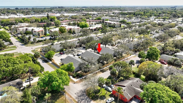 birds eye view of property with a residential view