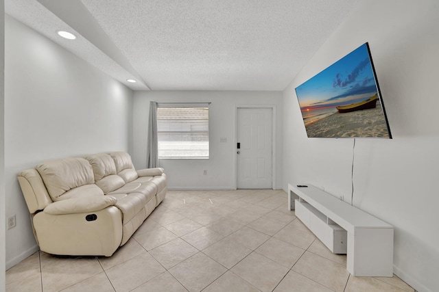 tiled living room with a textured ceiling