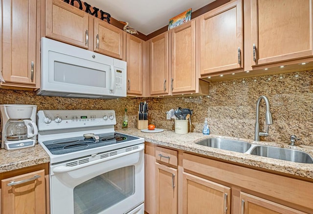 kitchen featuring tasteful backsplash, sink, white appliances, and light brown cabinets