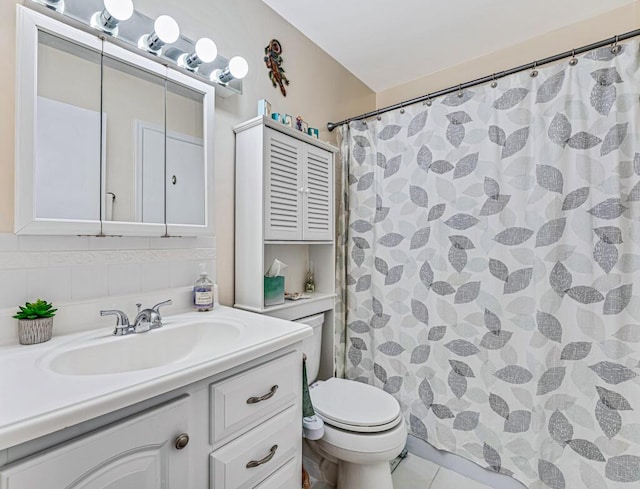 bathroom featuring vanity, toilet, curtained shower, and tile patterned flooring