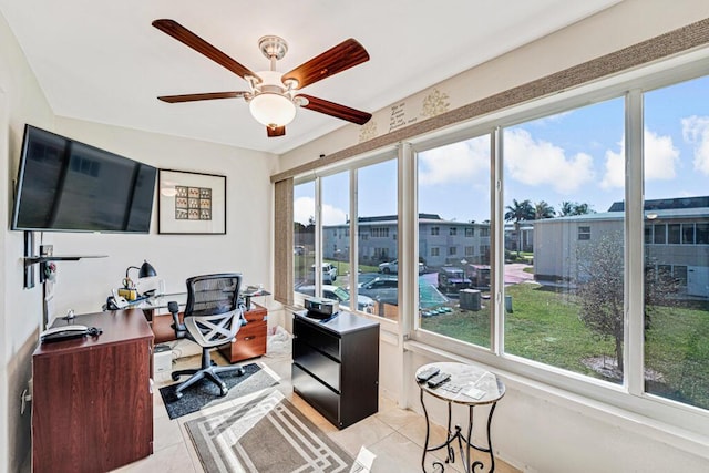 office with light tile patterned floors and ceiling fan