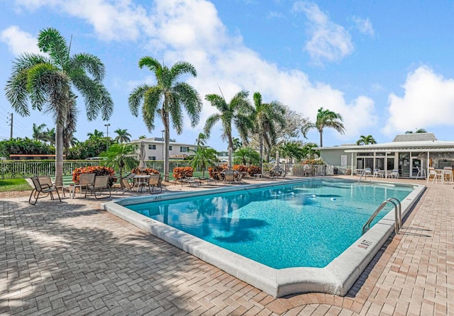 view of swimming pool featuring a patio area