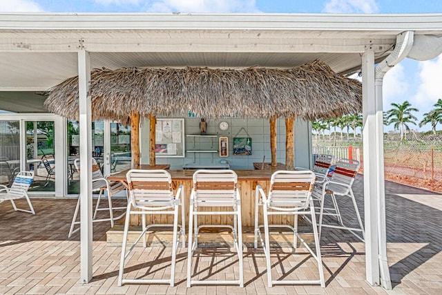 view of patio / terrace featuring an outdoor bar