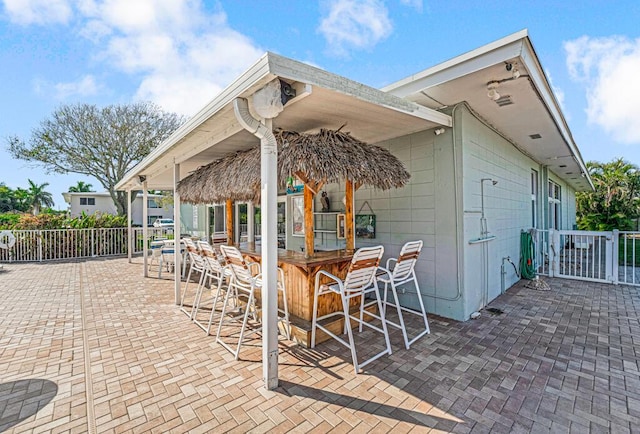 view of patio with exterior bar