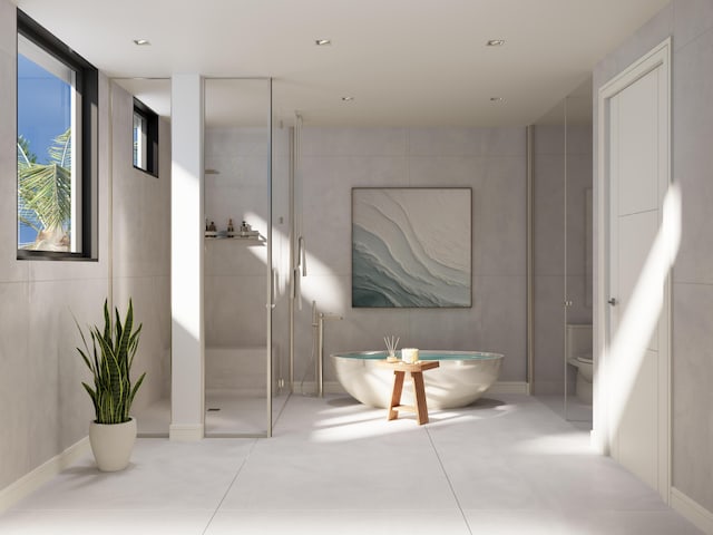 bathroom featuring independent shower and bath, tile walls, and toilet