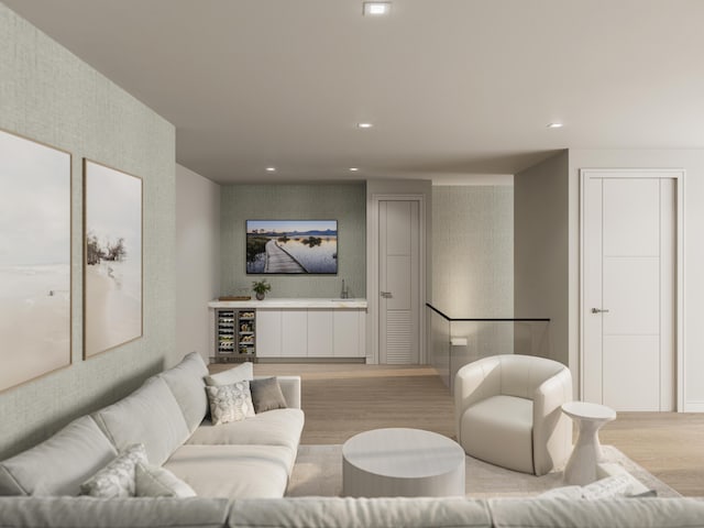 living room with sink, beverage cooler, and light wood-type flooring