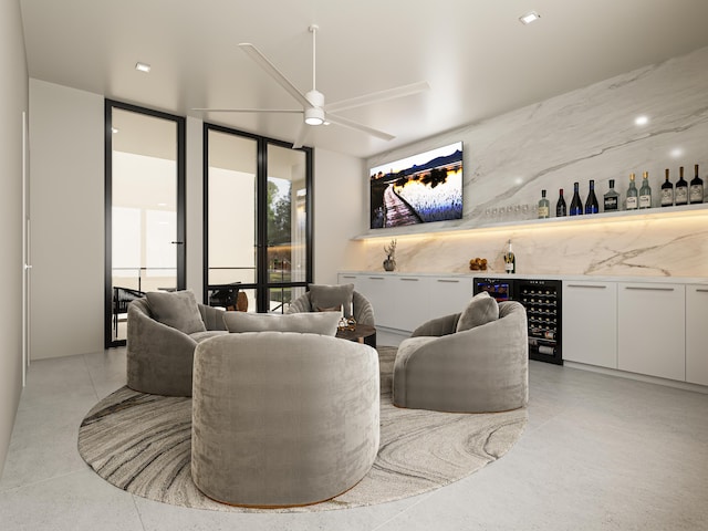 interior space with wine cooler, expansive windows, ceiling fan, and bar area