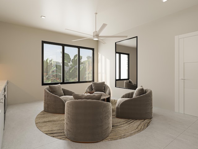 living room with plenty of natural light and ceiling fan