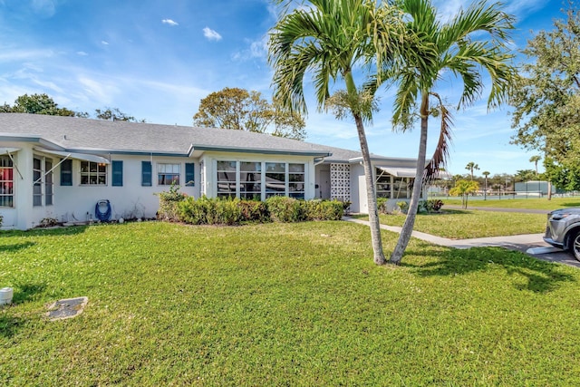 ranch-style house with a front yard