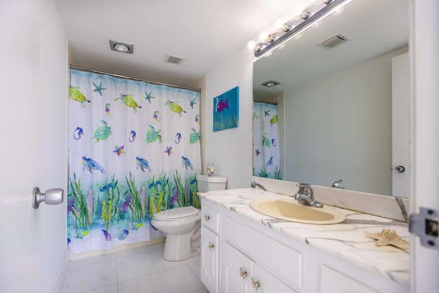 bathroom featuring vanity, curtained shower, tile patterned floors, and toilet