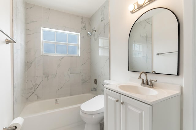bathroom featuring washtub / shower combination, toilet, and vanity