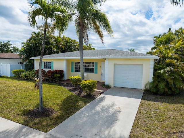 ranch-style home with an attached garage, fence, concrete driveway, stucco siding, and a front lawn