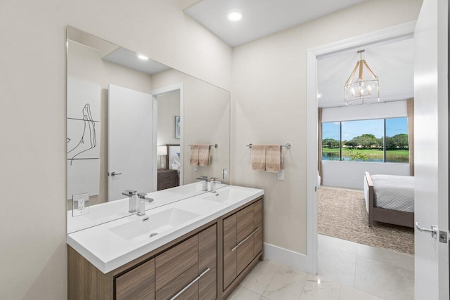 bathroom featuring vanity and a chandelier