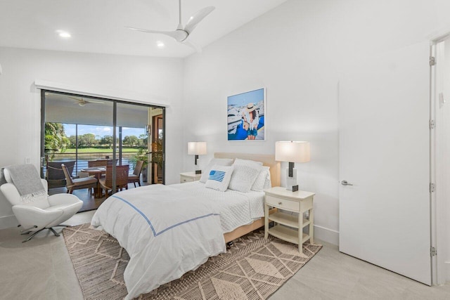 bedroom featuring a high ceiling, access to exterior, and ceiling fan