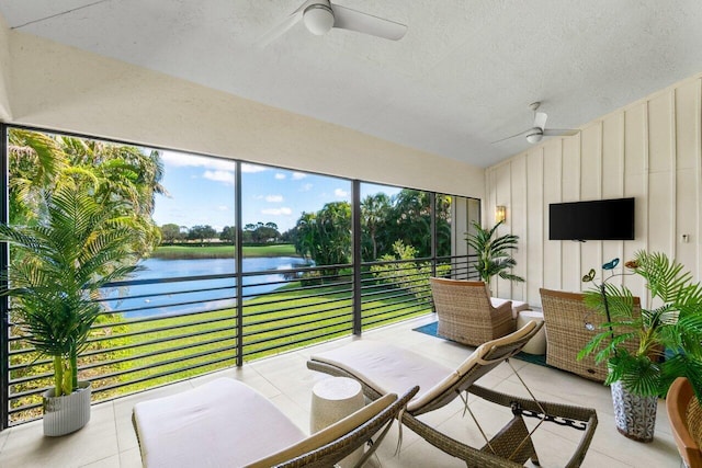 sunroom featuring vaulted ceiling and ceiling fan