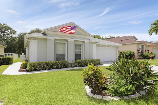 view of front facade with a garage and a front yard