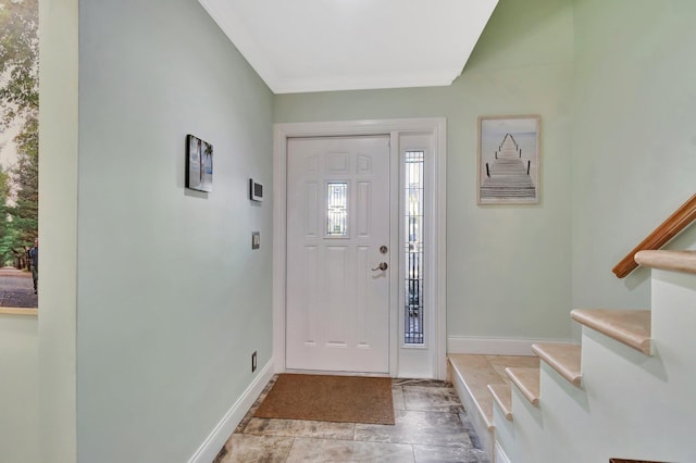 entryway featuring ornamental molding