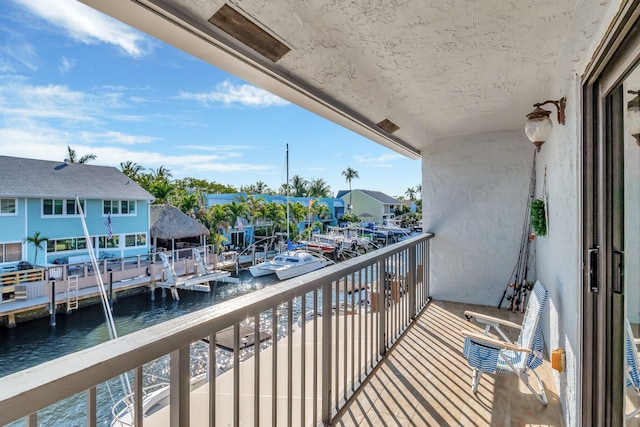 balcony featuring a water view