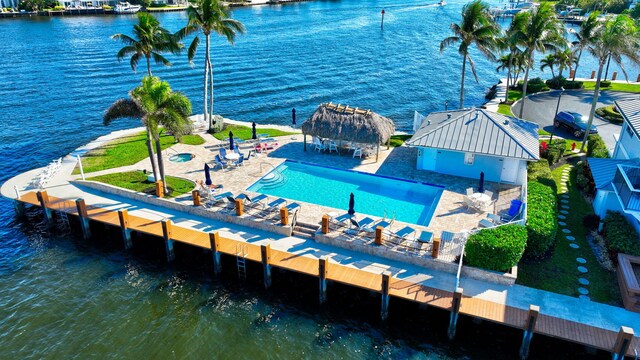 birds eye view of property with a water view