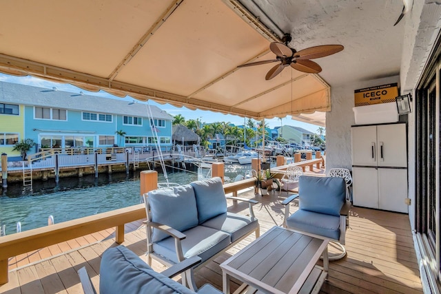 exterior space featuring a water view and an outdoor living space