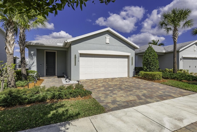 single story home featuring a garage