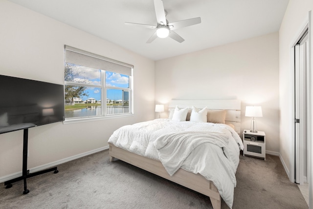 bedroom with light carpet and ceiling fan