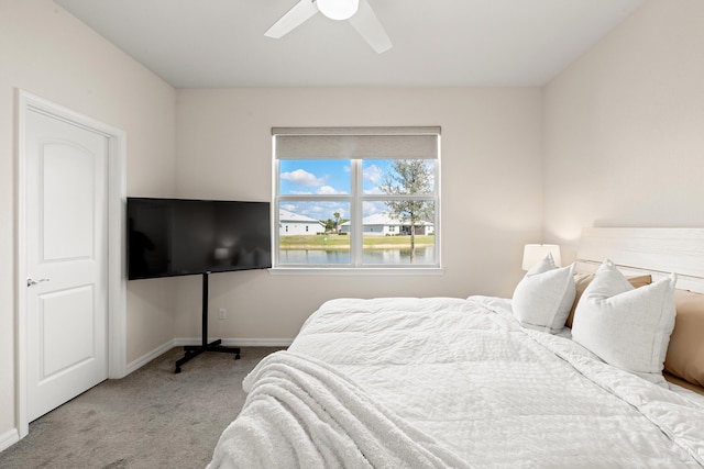 bedroom with light carpet and ceiling fan