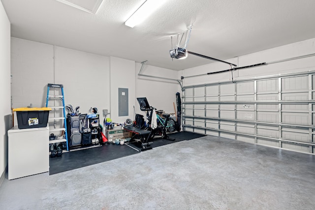 garage featuring a garage door opener and electric panel