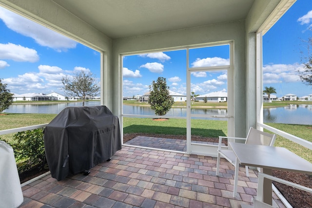 sunroom with a water view