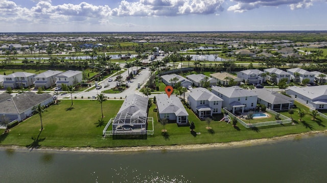 birds eye view of property featuring a water view