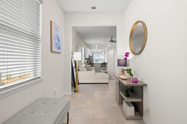 hallway featuring light tile patterned floors