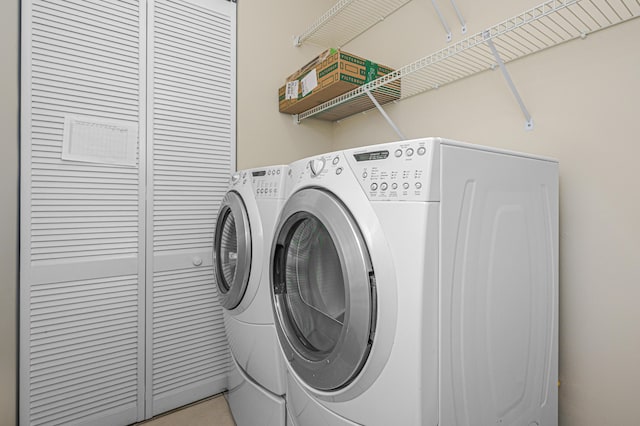 washroom featuring independent washer and dryer