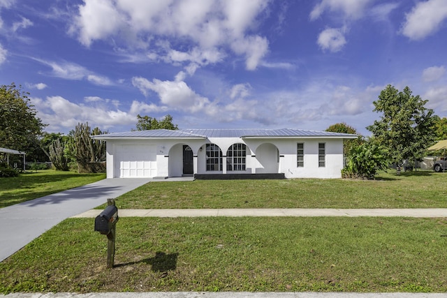 ranch-style house with a front yard and a garage