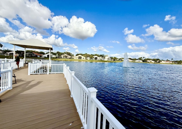 dock area with a gazebo and a water view