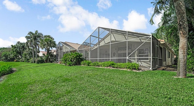 view of yard with glass enclosure