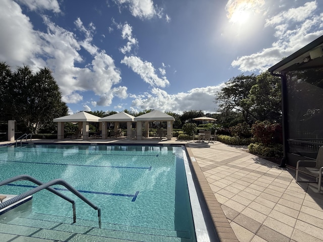 view of swimming pool featuring a gazebo and a patio area