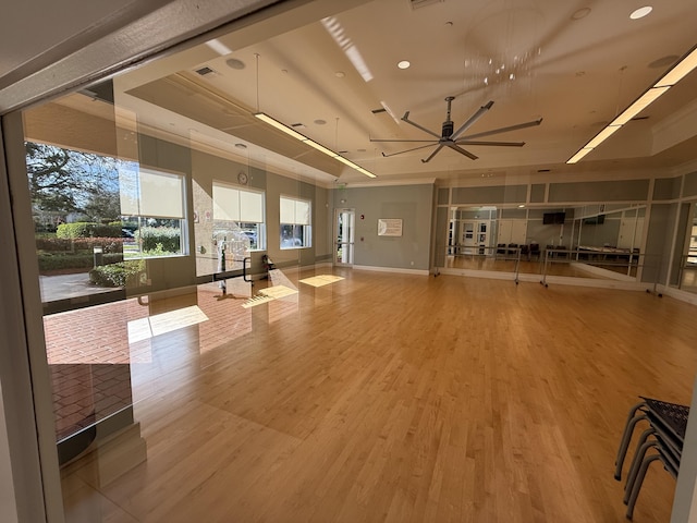 interior space with wood-type flooring and ceiling fan