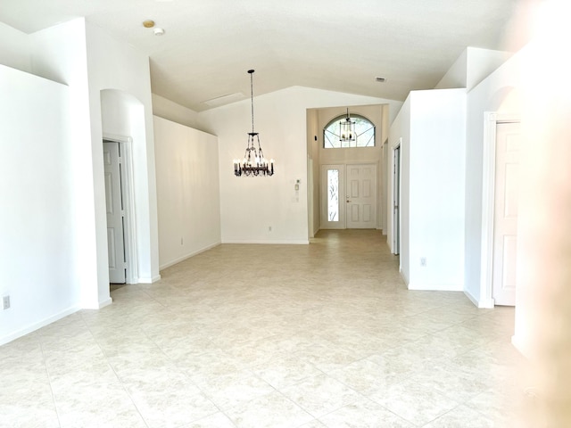 interior space with lofted ceiling and a notable chandelier